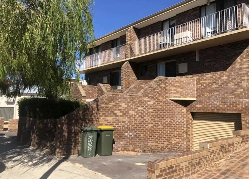 Brick stair walls beside a willow tree before rendering