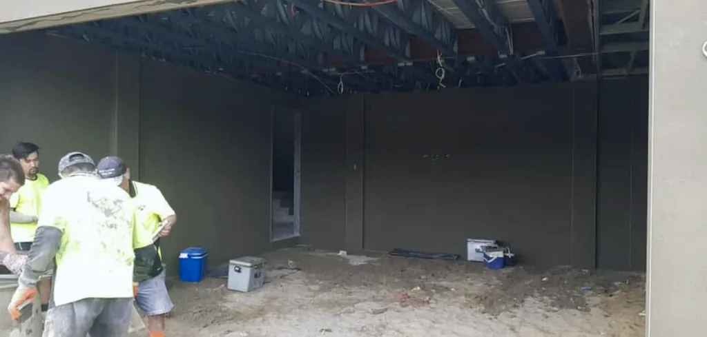 Rendered internal walls with crew on site