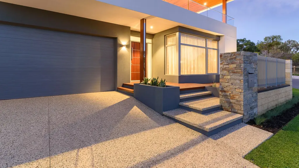 Reference image of grey walls and a timber entry at dusk