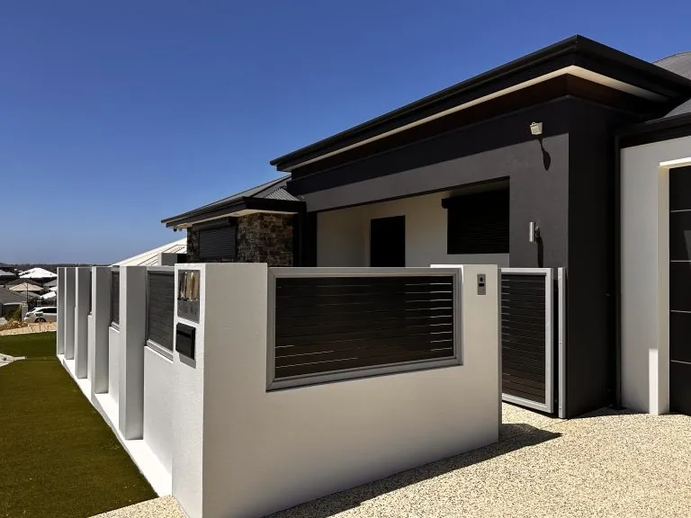 Reference image of white fence piers with slatted panels