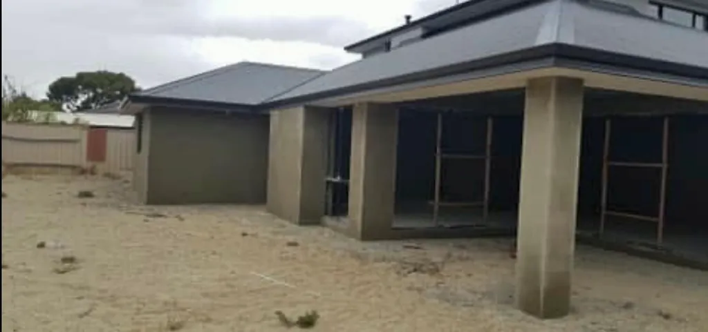 Single-storey home with rendered walls and columns