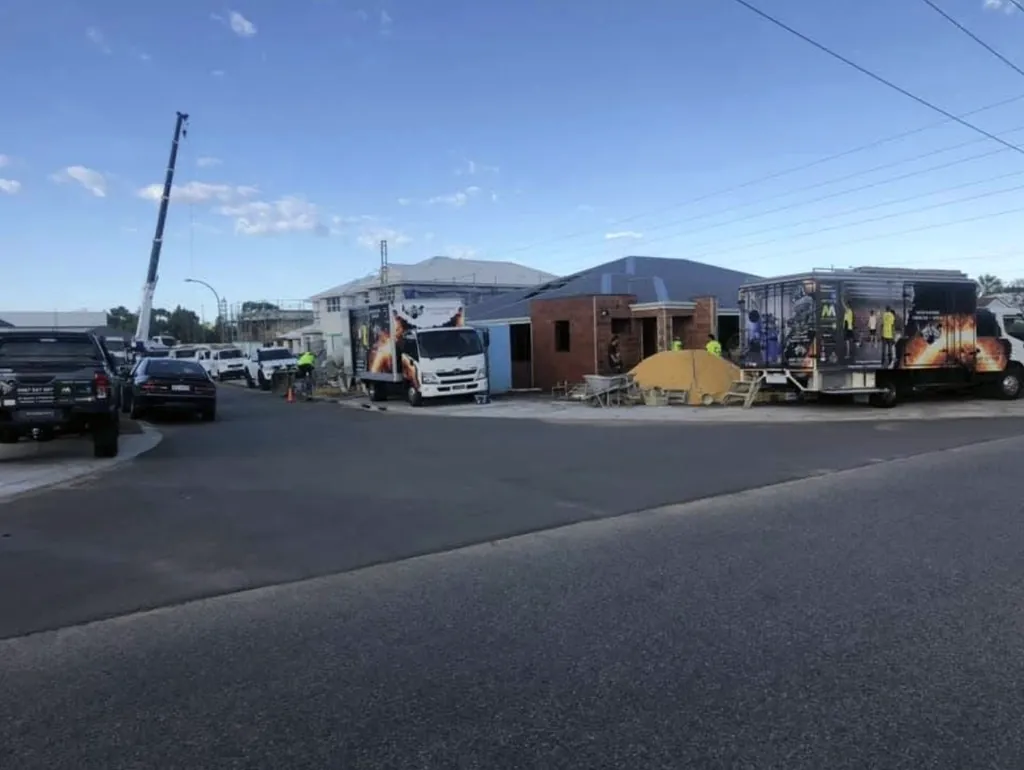 Master Plastering trucks parked along a street